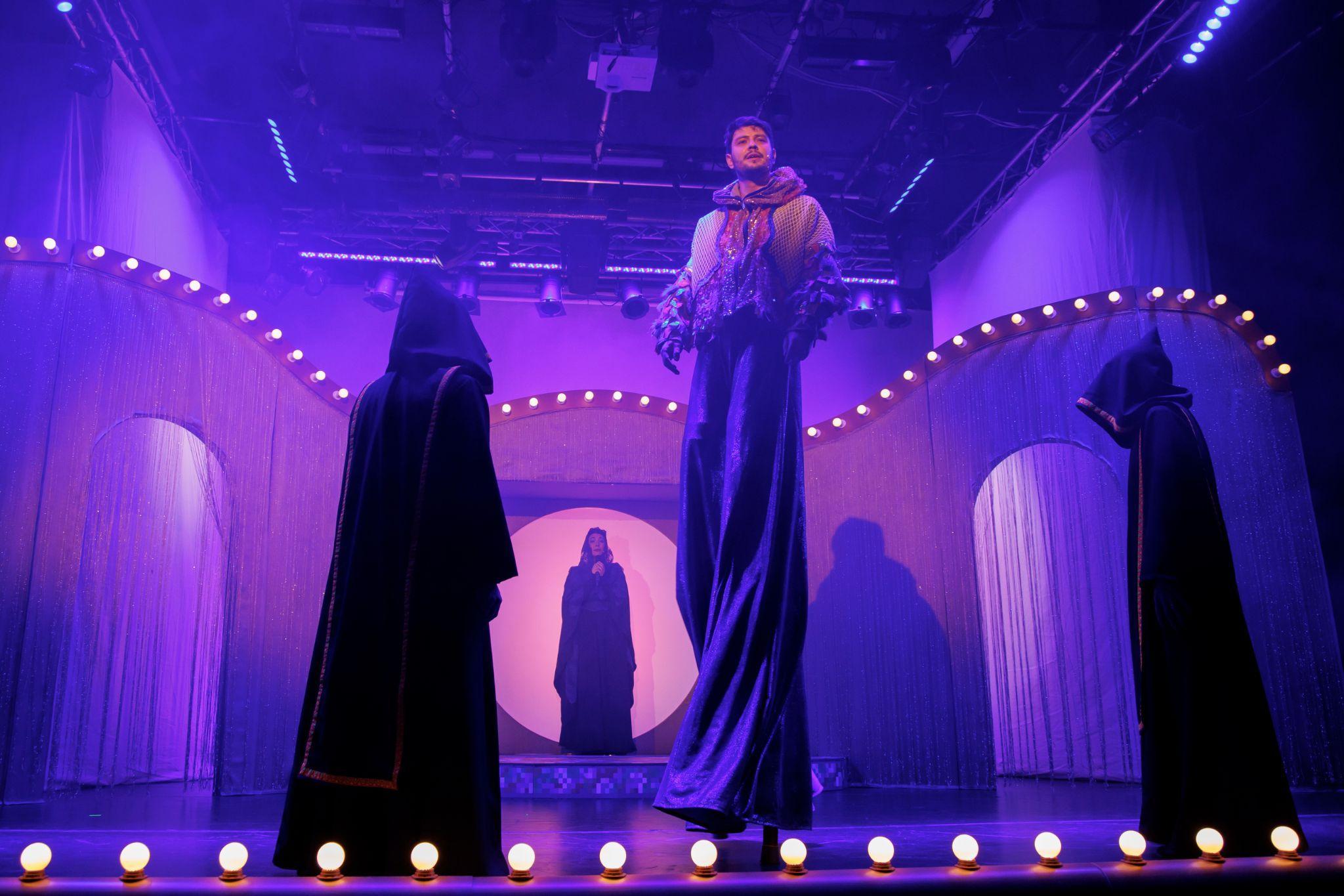 Three performers in front of purple curtains in Death at the Revue Theatre (Moarte la Teatrul de Revistă)